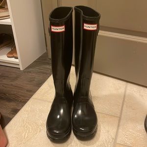 Tall shiny black Hunter boots